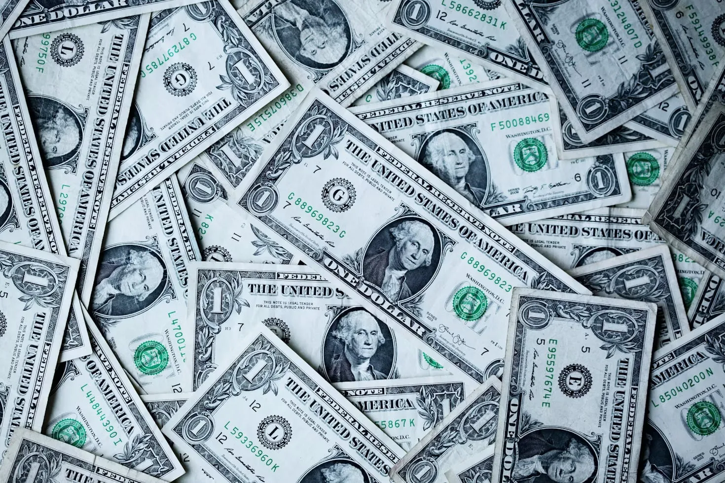 Overlapping United States one-dollar banknotes.